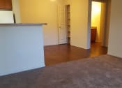 Thumbnail 10 of 21 - Living area with kitchen and pantry space at DOVER WOODS SENIOR APARTMENTS, Fairfield, CA 94533