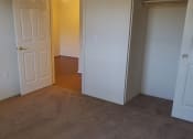 Thumbnail 16 of 21 - Bedroom with closet space at DOVER WOODS SENIOR APARTMENTS, California