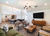Thumbnail 35 of 38 - a living room and dining room with a large tv on the wall at THE ARLO, Citrus Heights, 95621