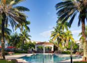 Thumbnail 5 of 24 - Pool with lounge chairs at Banyan Pointe, Coconut Creek, FL 33073