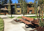 Thumbnail 8 of 25 - A park with benches at Bridge Meadows Beaverton 55+, Beaverton, OR 97005