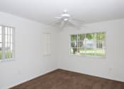 Thumbnail 21 of 24 - Bedroom with carpet and window at Banyan Pointe, Coconut Creek, 33073