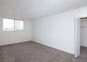 Thumbnail 20 of 23 - Bedroom with window and closet at Aqua 2800, Florida, 33309