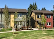 Thumbnail 20 of 25 - A row of houses with a green lawn in front.at Bridge Meadows Beaverton 55+, Oregon