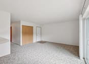 Thumbnail 51 of 74 - A room with a carpeted floor and white walls.