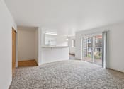 Thumbnail 66 of 74 - A large, empty room with a carpeted floor and white walls.