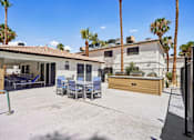 Thumbnail 6 of 22 - Outdoor courtyard with seating and hot tub at Dash Apartments, Las Vegas