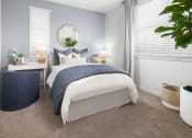 Thumbnail 8 of 35 - a bedroom with a bed and two windows with white blinds at Solstice at Fiddyment Ranch, California