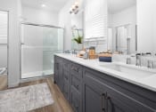 Thumbnail 9 of 35 - bathroom with grey cabinets and walk in shower at Solstice at Fiddyment Ranch, California, 95747
