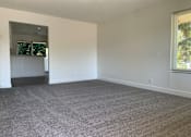 Thumbnail 7 of 24 - Carpeted Living Area at OTAVON APARTMENTS, Novato, 94947