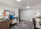 Thumbnail 39 of 74 - A modern office with a desk, chair, and computer.