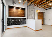 Thumbnail 42 of 81 - a large room with a door and a scoreboard on the wall