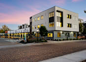 Thumbnail 57 of 81 - the building where the hotel is located is lit up at dusk