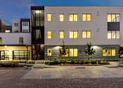 Thumbnail 59 of 81 - an exterior view of an apartment building at night