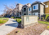 Thumbnail 2 of 12 - A gated community with a sign that says Agave at AGAVE APARTMENTS, Elk Grove, CA 95757