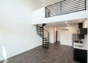 Thumbnail 20 of 41 - a view of the kitchen and living room from the top of the stairs at THE ANGELINO, California, 95819