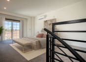 Thumbnail 2 of 41 - a bedroom with a bed and a stool near a window at THE ANGELINO, California