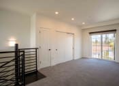 Thumbnail 16 of 41 - Large room with windows and closet at THE ANGELINO, Sacramento, CA 95819