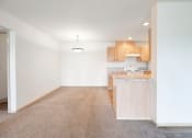 Thumbnail 9 of 24 - View of dining and kitchen area from living room at Devonwood and First Place Apartments, Battle Ground, WA