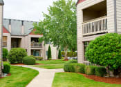 Thumbnail 3 of 24 - Beautifully Landscaped Grass Courtyard at Devonwood and First Place Apartments, Washington, 98604