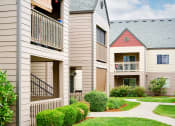 Thumbnail 20 of 24 - Building exteriors and lush landscaping at Devonwood and First Place Apartments, Washington