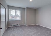 Thumbnail 21 of 63 - Bella Sonoma - Bedroom with Window, Grey Walls, Grey Carpeting, and Sliding Closet Doors at BELLA SONOMA, Washington
