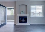 Thumbnail 16 of 63 - Spacious Living Room With Large Windows And Fireplace With Mantle at BELLA SONOMA, Fife, WA