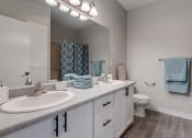 Thumbnail 13 of 63 - Bathroom With Double Sink Vanity And Wood-Style Flooring And Deep Set Tub at BELLA SONOMA, Washington