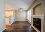 Thumbnail 17 of 63 - Living Room with Wood-Style Flooring, Grey Walls, and Fireplace at BELLA SONOMA, Fife, 98424