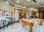 Thumbnail 30 of 63 - Billiards Room with Billiard Table, Hanging Light, and Stylish, Modern Decor, Surrounded by Seating at BELLA SONOMA, Fife, WA 98424