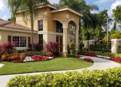 Thumbnail 13 of 13 - a home with a round driveway and palm trees at Hibiscus Pointe, Miami Florida 