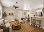 Thumbnail 15 of 22 - Open concept living room and dining area at Dash Apartments, Las Vegas, 89104