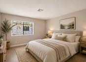 Thumbnail 18 of 22 - Bedroom with neutral tones and natural light at Dash Apartments, Nevada, 89104