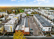 Thumbnail 61 of 81 - an aerial view of a suburb of a city with houses and cars
