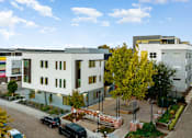 Thumbnail 63 of 81 - an aerial view of a building with cars parked in front of it