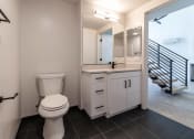 Thumbnail 7 of 24 - a bathroom with a toilet and a sink and a mirror at Luella, California