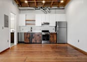 Thumbnail 30 of 81 - a kitchen with white cabinets and stainless steel appliances