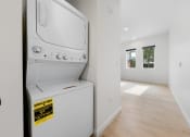 Thumbnail 13 of 81 - an empty laundry room with a washer and dryer