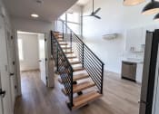 Thumbnail 8 of 24 - a staircase with wood treads leading up to a room at Luella, Sacramento, CA