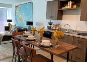Thumbnail 30 of 34 - a kitchen and dining room with a wooden table and chairs at FARM BY VINTAGE, MILL CREEK, 98012