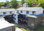Thumbnail 2 of 12 - exterior of the building with patio and balcony at FIRE TOWER Apartments, HELENA