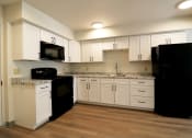 Thumbnail 8 of 12 - Kitchen with appliances at FIRE TOWER Apartments, HELENA, Montana