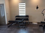 Thumbnail 7 of 11 - fitness center with free weights at The Edge at Town Center Apartments, Jacksonville 32224
