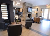 Thumbnail 3 of 11 - lounge area with seating and tv at The Edge at Town Center Apartments, Jacksonville, FL