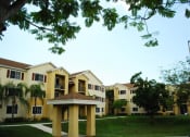 Thumbnail 7 of 11 - Exterior of building with grass at Alhambra Cove, Miami, Florida