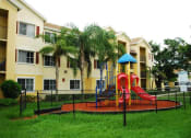 Thumbnail 3 of 11 - Fenced playground at Alhambra Cove, Miami