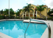 Thumbnail 2 of 11 - Pool With Seating at Alhambra Cove, Miami Florida