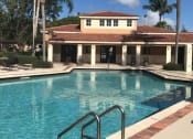 Thumbnail 16 of 19 - Pool with lounge chairs at Golden Lakes, Miami, FL 33169