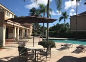 Thumbnail 17 of 19 - Seating by the pool at Golden Lakes, Florida , 33169