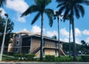 Thumbnail 6 of 19 - Exterior of building with parking and landscape at Golden Lakes, Miami Florida